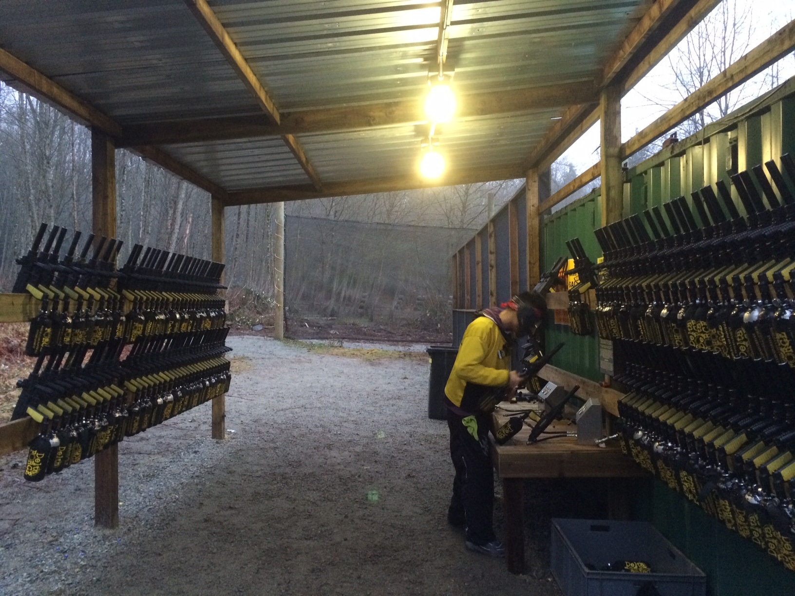 A Delta Force marshal checking paintball markers before play